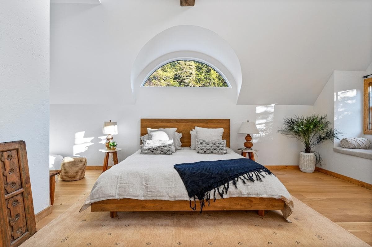 Very spacious upstairs bedroom with plenty of light, work desk, couch in corner and full bathroom